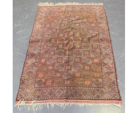 A Tabriz rug, Central Persia, late 20th century, the compartmentalized field within a flowerhead border, 170cm x 117cm.Buyer’