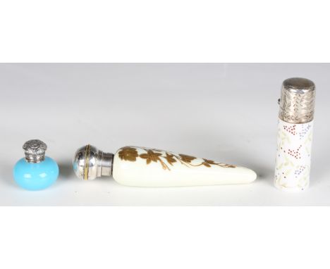 A late 19th century opaline glass and white metal scent bottle, length 8cm, a late Victorian ivory toned porcelain scent bott