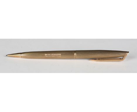 A 9ct gold cased propelling pencil with engine turned decoration, engraved 'N. F. Mc M. 1928-1957', London 1956, length 13.5c