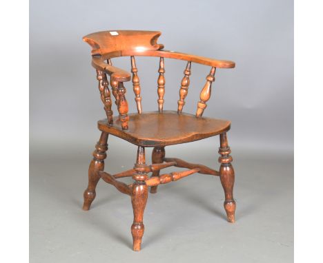 A mid-Victorian beech and elm captain's tub back elbow chair, height 80cm, width 67cm, depth 61cm.Buyer’s Premium 29.4% (incl