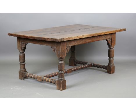 A late 19th century Jacobean Revival oak refectory table with a thick four-plank top, height 72cm, length 160cm, depth 101cm,