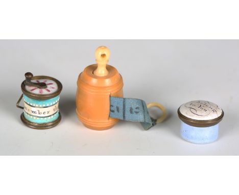 A 19th century Staffordshire enamel and gilt metal needlework tape measure, the cylindrical barrel inscribed 'Remember the Gi