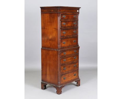 A 20th century reproduction walnut tallboy, fitted with eight drawers, height 155cm, width 63cm, depth 45cm.Buyer’s Premium 2