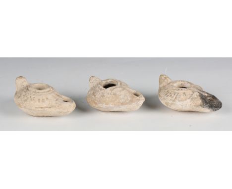 A group of three Roman pottery oil lamps, length 9cm.Buyer’s Premium 29.4% (including VAT @ 20%) of the hammer price. Lots pu
