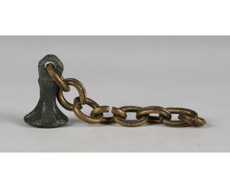A Medieval base metal chessmen style seal, the circular matrix engraved with an 'M', diameter 1.4cm, fitted to a gilt metal c