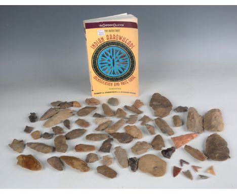 A collection of various Native American flint arrow heads and other artefacts, together with a small group of various British