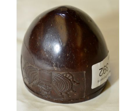 19thC carved nut cup with carved detail of drum, helmet, flags and cannons