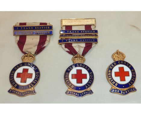 Enamel British Red Cross Society 3 year service medal with 2 additional bars, another similar medal with 3 additional bars an