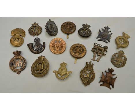Large selection of restrike Victorian regimental cap and helmet badges for various regiments inc 96, 52nd, Manchester, 17th e