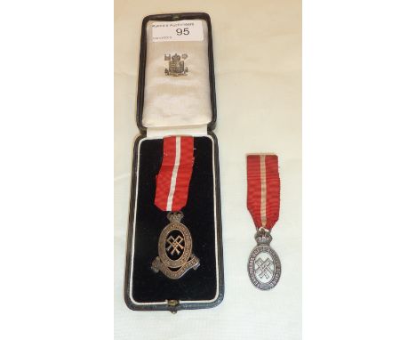 Silver hallmarked territorial army nursing service miniature service cape badge and another similar (2)