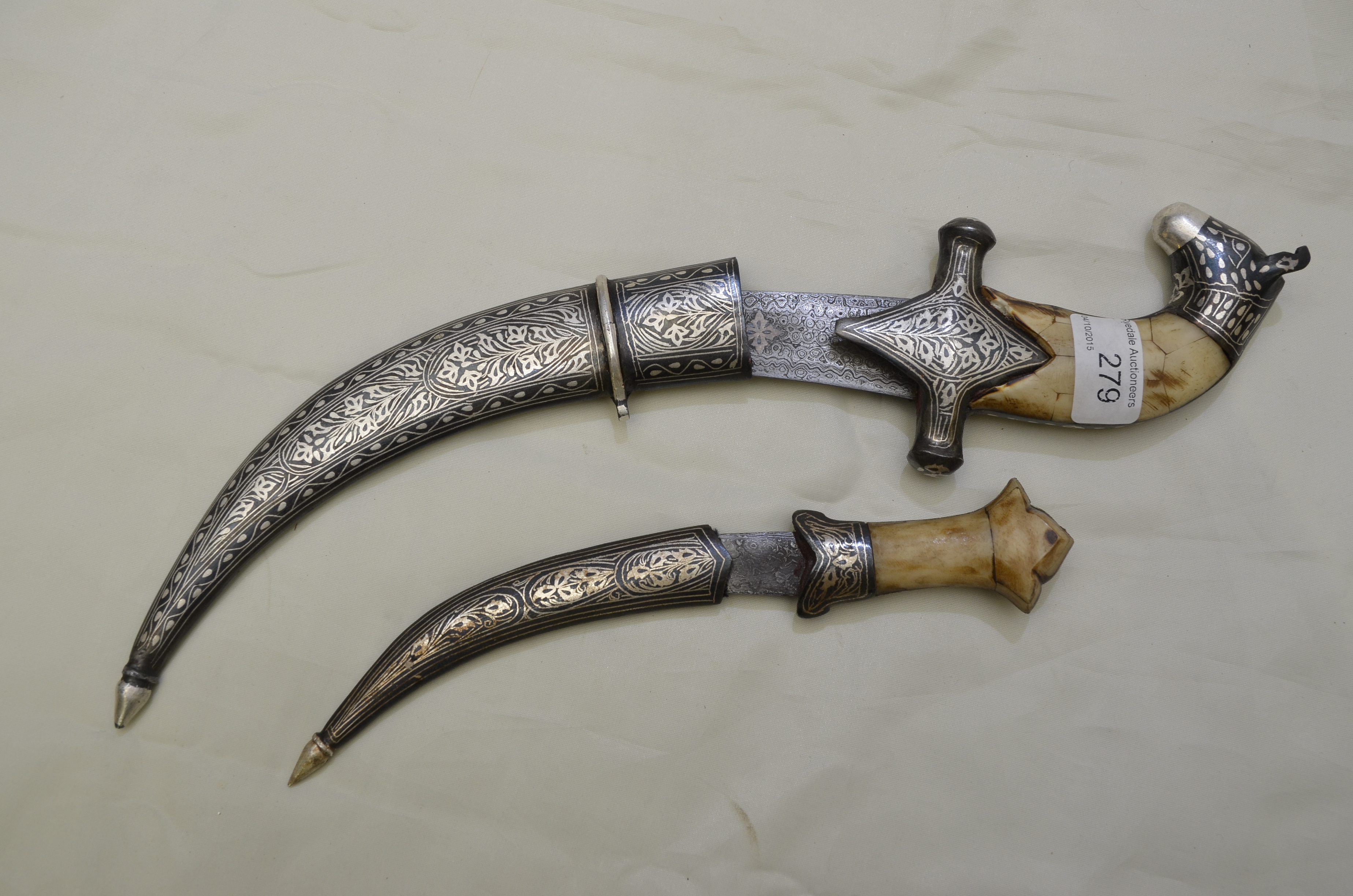 Indo Persian silver inlaid dagger with 9 inch curved damascus blade