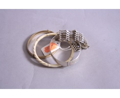 A STERLING SILVER SIX BAR GATE BRACELET, together with silver fixed bracelet and gold plated hollow bangle, etc (4)