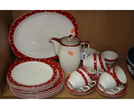 MIDWINTER 'RED DOMINO' PART DINNER WARES, to include coffee pot, six coffee cups and saucers, milk jug, sugar bowl, five 22cm