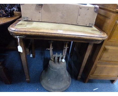 AN OAK FRAMED FOLDING CARD TABLE, with green velvet top
