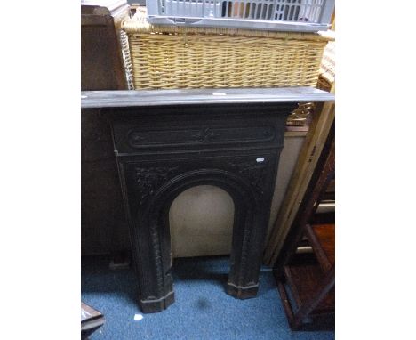 A CAST METAL FIRE SURROUND, approximate size height 98cm x width 74cm