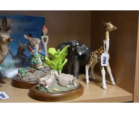 TWO BESWICK FIGURES, Giraffe, small No.853 and Elephant, trunk stretching, small, No.974 together with two John Beswick Beatr