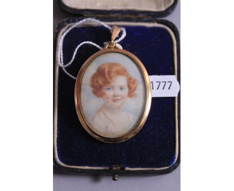 A 19TH CENTURY PORTRAIT MINIATURE OF AN UNKNOWN YOUNG GIRL, oval rub over design pendant measuring approximately 50mm x 40mm,