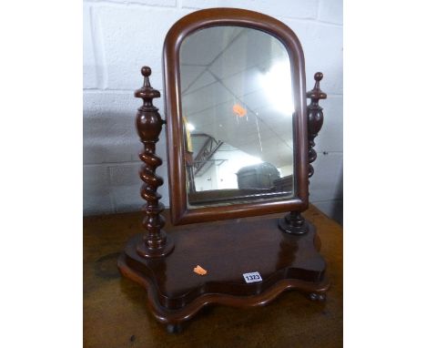 A VICTORIAN MAHOGANY SWING MIRROR, with spiral supports