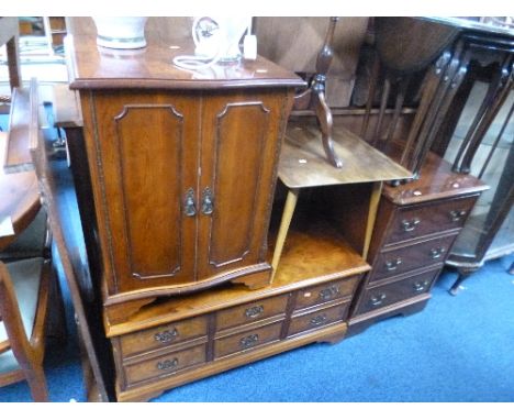 A MODERN YEW WOOD CHEST, of three drawers, similar TV unit, hi-fi cabinet, table lamp and vase with contents (sd) (key)