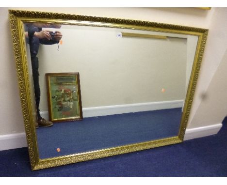 A LARGE GILT FRAMED WALL MIRROR, approximate size 132cm x 102cm