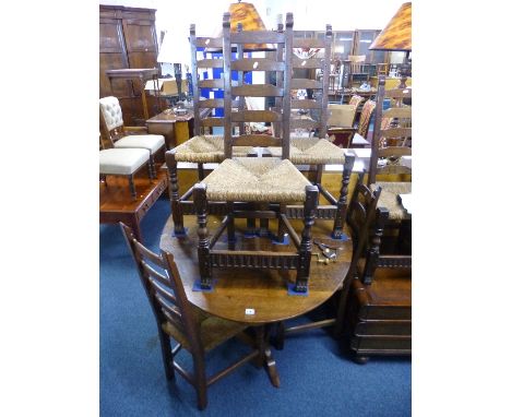 A NIGEL GRIFFITHS OAK DROP LEAF DINING TABLE, approximate size extended length 157cm x width 105cm x height 72cm and six rush