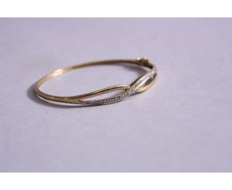 A 9CT BANGLE SET WITH DIAMONDS