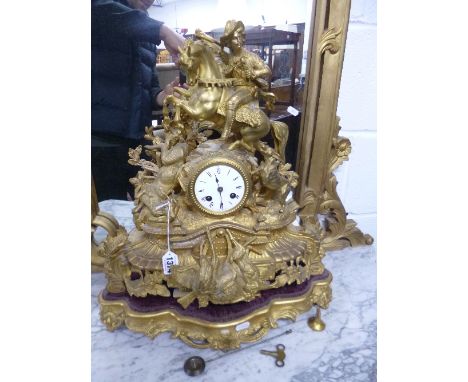 A FRENCH GILT PAINTED MANTLE CLOCK, with hunting related detail depicting various dead game, etc, on seperate base (sd) (key 