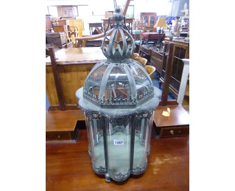 A MODERN OCTAGONAL HANGING OR FREESTANDING LANTERN, with bowed glass panels and hinged top, approximate height 72cm