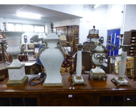 A CAMPANA SHAPED POTTERY URN, table lamp base, table candelabrum and a pair of candlesticks, all with brass fitments (5)