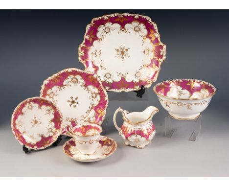 TWENTY EIGHT PIECE ROCKINGHAM STYLE PORCELAIN PART TEA SERVICE, now suitable for nine persons, with ornate pink and gilt bord