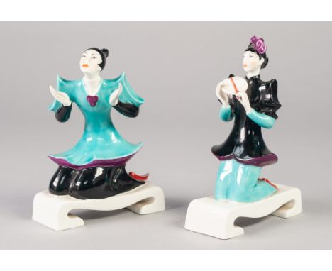 AN UNUSUAL PAIR OF EARLY 1950's ROYAL WORCESTER PORCELAIN 'CHINOISERIE' FIGURES, both kneeling on oblong scroll end bases, on