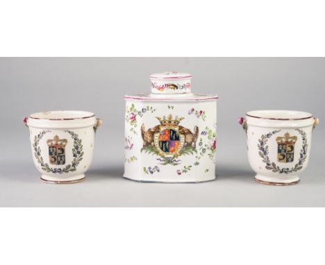 EARLY TWENTIETH CENTURY FRENCH FAIENCE POTTERY ARMORIAL TEA CADDY AND COVER, of canted oblong form with slightly domed cover,