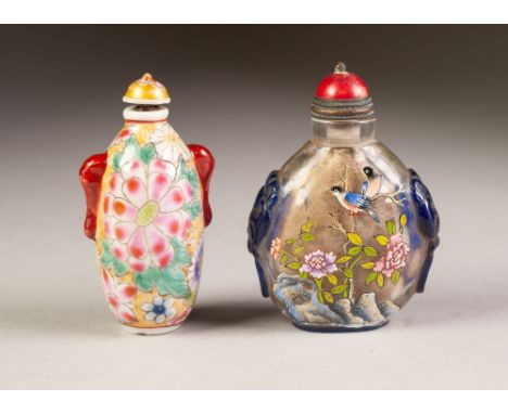 A GOOD CHINESE CLEAR AND BLUE OVERLAY CAMEO GLASS SNUFF BOTTLE, enamelled on each side with birds perched upon flowering tree