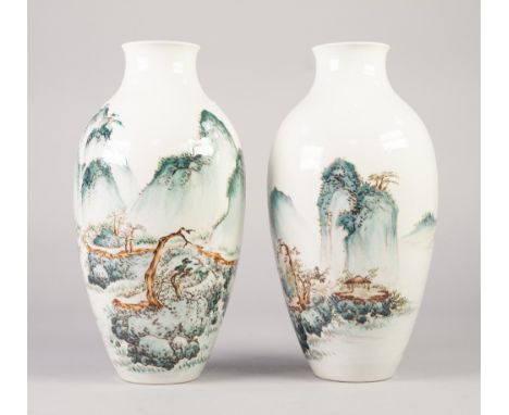 A FINE PAIR OF CHINESE REPUBLIC PERIOD (1911-1949) PORCELAIN SLENDER OVIFORM  VASES painted in overglaze enamels in the manne