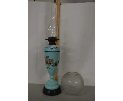 Green glass oil lamp with floral decoration and white shade