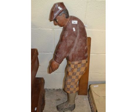 Wooden model of a golfer