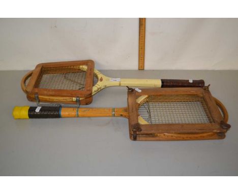 Two vintage tennis rackets and holders by Slazenger and Dunlop