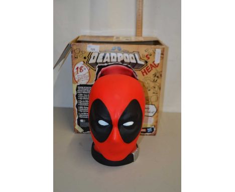 A boxed model of a Deadpool head
