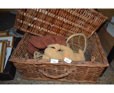 A wicker box containing a small model of a rabbit