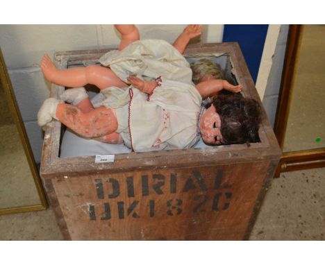 Tea trunk containing quantity of dolls and paperback books by Enid Blyton and others