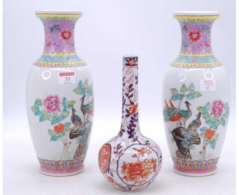 A pair of Chinese Canton famille rose vases, enamel decorated with birds amongst flowers, enamel zhuanshu seal mark to the un