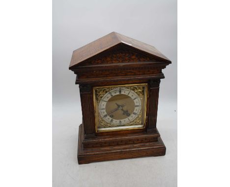 An early 20th century Winterhalder &amp; Hofmeier oak cased mantel clock, of architectural form, the silvered chapter ring sh