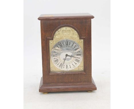 A 1977 Silver Jubilee commemorative mantel clock, the silver dial showing Roman numerals and signed Charles Frodsham, London,