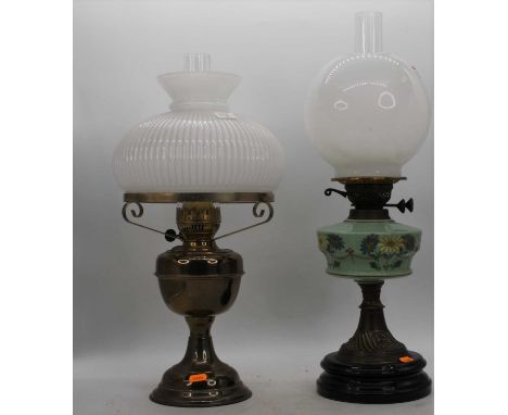 A 19th century brass oil lamp, the milk glass shade above a green glass font, h.57cm; together with another 19th century bras