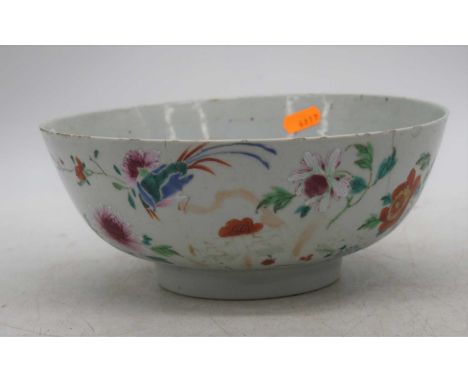 An 18th century Chinese export porcelain bowl, enamel decorated with flowers, dia.23.5cm (a/f)