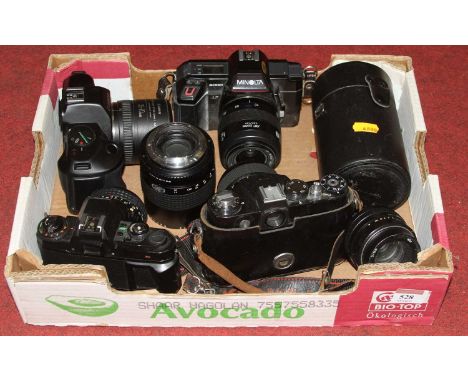 A Minolta 5000AF SLR camera, together with various other cameras and lenses 