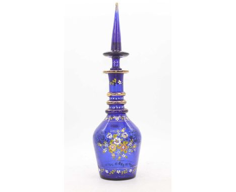 A cobalt blue glass decanter, enamel decorated with flowers, h.51cmNo damage to the decanter. Appears free of cracks, damage 