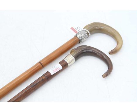 An early 20th century walking stick, the carved horn handle having basketweave white metal collar and bamboo shaft, 89cm; tog