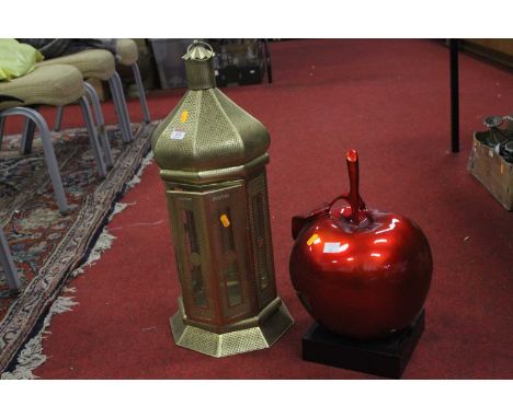 A modern gilt metal hanging lantern, h.62cm; together with a red painted model of an apple, h.43cm 