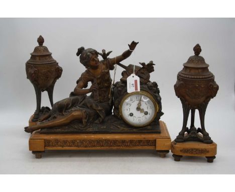 A 19th century figural spelter mantel clock garniture, the enamelled dial showing Arabic numerals, h.30cm 